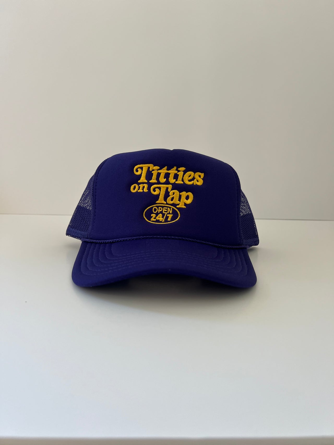 Titties On Tap™ Trucker Hat (Purple / Gold)